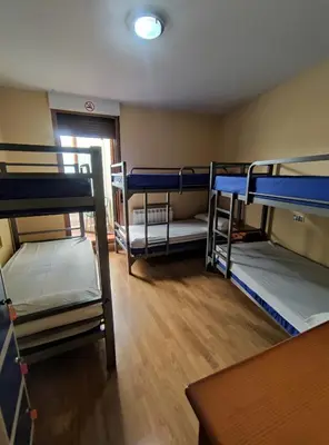 a dorm room with several bunk beds in it at La Gallega in Cacabelos