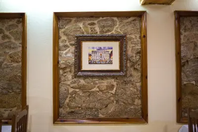 a picture on a stone wall with a picture on it at Hotel Victorino in Silleda