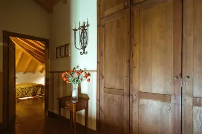a room with a vase of flowers on a table at El Tiempo Recobrado - Hotel de relax en El Bierzo in Villamartín de la Abadía