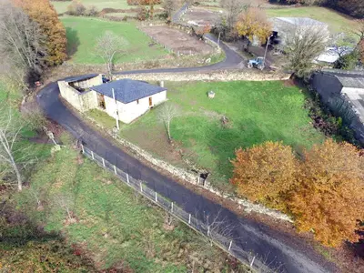 an aerial view of a house in a field at Casiña de Campo in Ferreiros