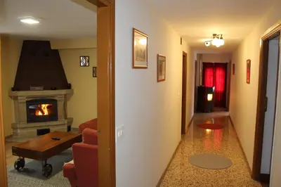 a hallway with a living room with a fireplace at Casa Solveira in Piñeiro