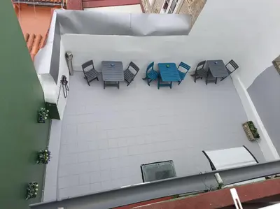 an overhead view of chairs and tables on a building at Pensión Casa Douro in Santiago de Compostela