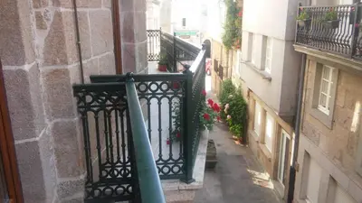 a view of an alley from a balcony of a building at Pension a Fontiña in Cuntis