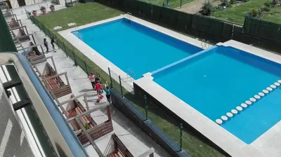 an overhead view of a large swimming pool on a building at Apartment Javier in Foz