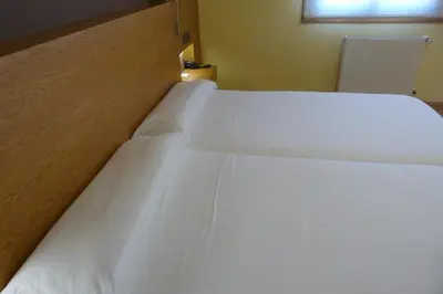 a close up of a bed in a room at Hotel Nordés in Burela de Cabo