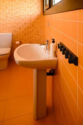 a bathroom with a sink and a toilet at Ático Lobariñas in Allariz