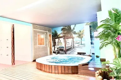 a large jacuzzi tub in the middle of a room at Hotel Spa Galatea in Burela de Cabo