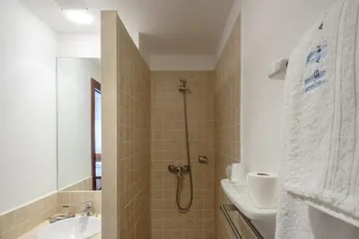 a bathroom with a shower and a sink at Hotel Restaurante San Anton in Tapia de Casariego