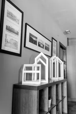 a shelf with three white mirrors on top of it at Hotel Restaurante San Anton in Tapia de Casariego