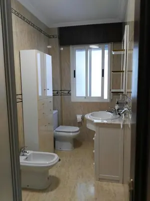 a bathroom with a toilet and a sink and a toilet istg at Arzúa Home in Arzúa