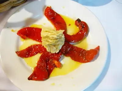 a plate of food with strawberries and cheese at Hotel Rural Suquin in Navia