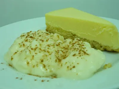 a piece of cake and a piece of cheesecake on a plate at Hotel Rural Suquin in Navia