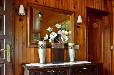 a room with a mirror and a table with flowers on it at Casa de Cacheiro - Silleda in Silleda