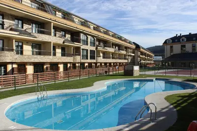 a large swimming pool in front of a building at Costa Reinante Spa in Barreiros