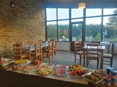 a table with many different types of food on it at Casa rural osvilares in Santiago de Compostela