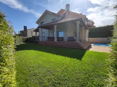 a house with a lawn in front of it at HHC - Holidays House Compostela in Santiago de Compostela