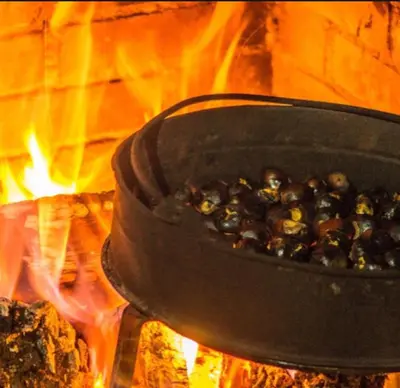 a pot of food sitting on top of a fire at Casaquina in La Mezquita