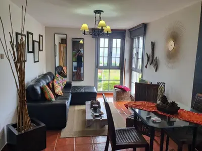 a living room with a couch and a table at apartamento Tita in Tapia de Casariego