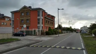 an empty street in front of a building at apartamento Tita in Tapia de Casariego