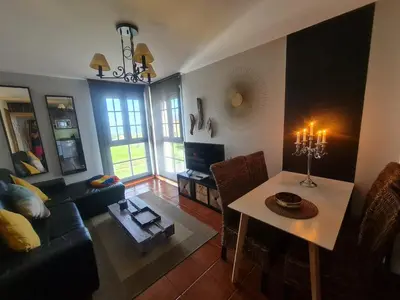 a living room with a couch and a table at apartamento Tita in Tapia de Casariego