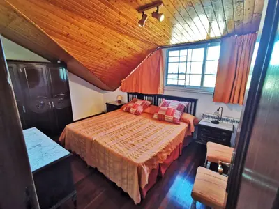 a bedroom with a bed and a sink at Casa Duarte in Cuntis