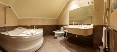 a bathroom with a tub and a toilet and a sink at Hotel MIRAVALLE in Ourense