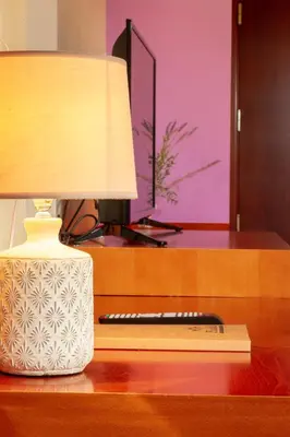 a lamp sitting on a desk next to a keyboard at Hotel MIRAVALLE in Ourense