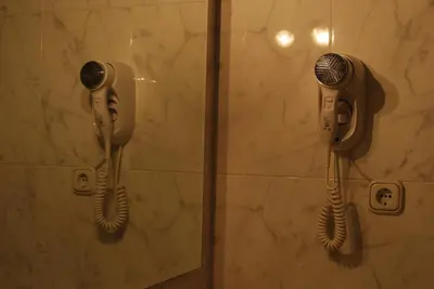 a shower with two hair dryers in a bathroom at Hotel San Jacobo in Santiago de Compostela