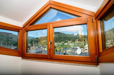 a window with a view of a city at Plaza Mayor in Villafranca del Bierzo