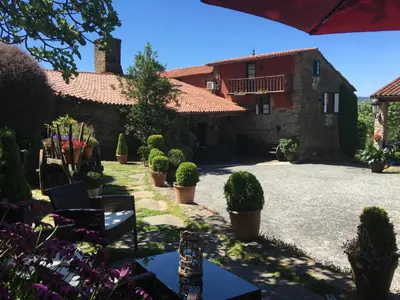 a courtyard of a house with potted plants at Casa Brandariz in Santa Maria de Arzua