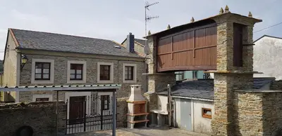 an old building with a balcony on top of it at Casa Julia De Lozano in Rinlo