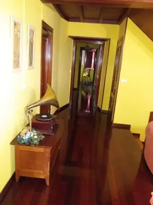 a living room with a lamp on a table at Casa Julia De Lozano in Rinlo