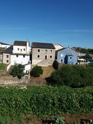 a group of houses sitting on top of a hill at Casa Julia De Lozano in Rinlo