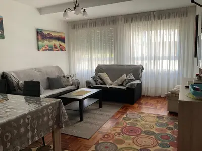 a living room with a couch and a table at Piso Mónica in Ribadavia