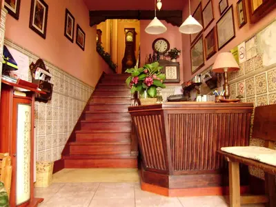a staircase in a restaurant with a stair case at Escuder Apartamentos Turísticos in Ribadeo