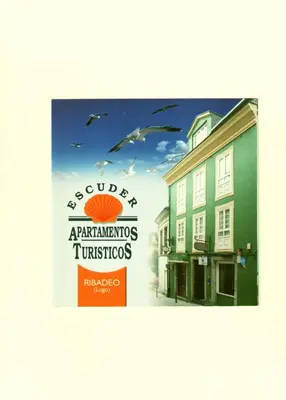 a picture of a building with a sign on it at Escuder Apartamentos Turísticos in Ribadeo