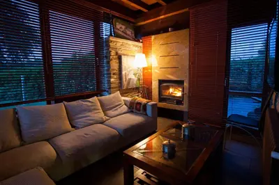 a living room with a couch and a fireplace at Casa Do Bosque in Sarria