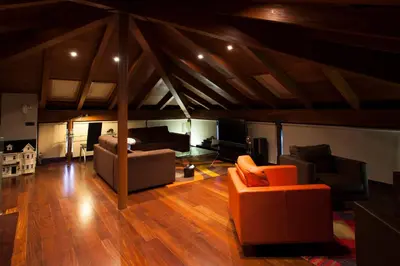 a living room with two couches and a tv at Casa Do Bosque in Sarria