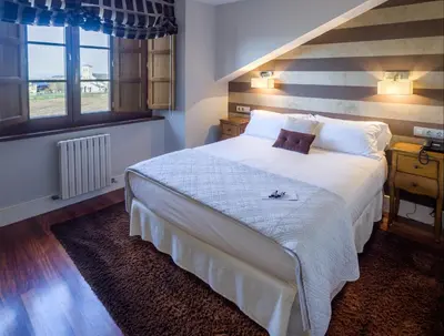 a bedroom with a large bed in a room at Casa de Castro in Cartavio