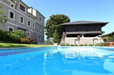 a swimming pool in front of a building at Casa de Castro in Cartavio