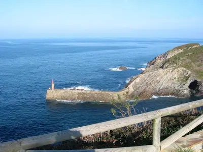 a lighthouse on an island in the middle of the ocean at Casa de Castro in Cartavio
