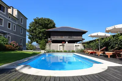 a swimming pool in a yard next to a building at Casa de Castro in Cartavio