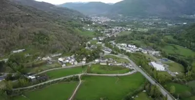 an aerial view of a village in the mountains at Hotel rural La Campanona in Villager de Laciana