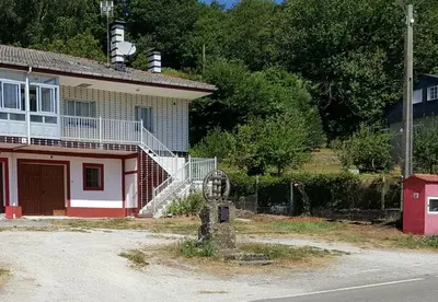 an old house with a white and red at Casa Páez in Pasantes