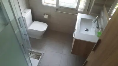 a small bathroom with a toilet and a sink at Casa Páez in Pasantes