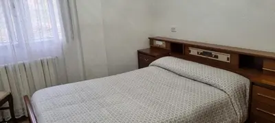a bedroom with a bed and a dresser and a window at Casa Páez in Pasantes