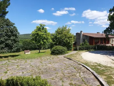 a house with a dirt road in front of it at Rectoral De Lestedo in Palas de Rei