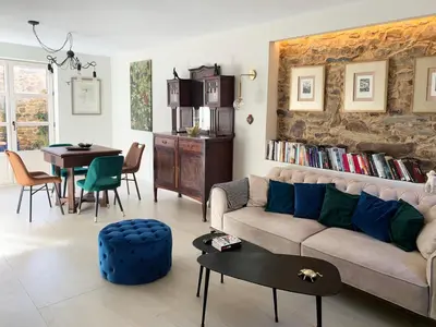 a living room with a couch and a table at Via Avis in Santa Catalina de Somoza