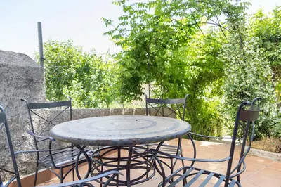 a table and chairs sitting on a patio at Stellae Luscofusco in Santiago de Compostela