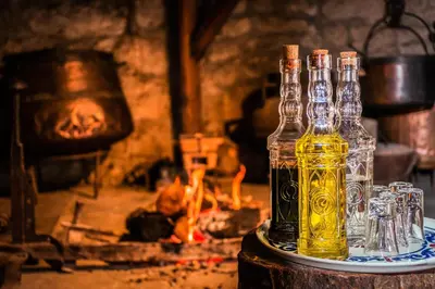 a bottle of oil sitting on a table with glasses at Casa Grande de Rosende in Sober